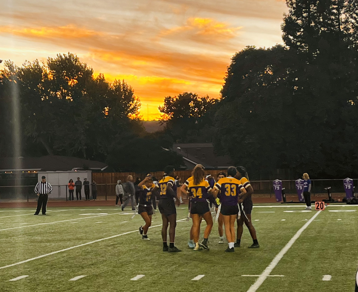 The flag football team gathers for another play against Foothill for their home game.